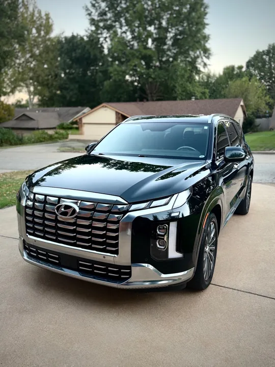 Black Hyundai Palisade photographed from the front corner