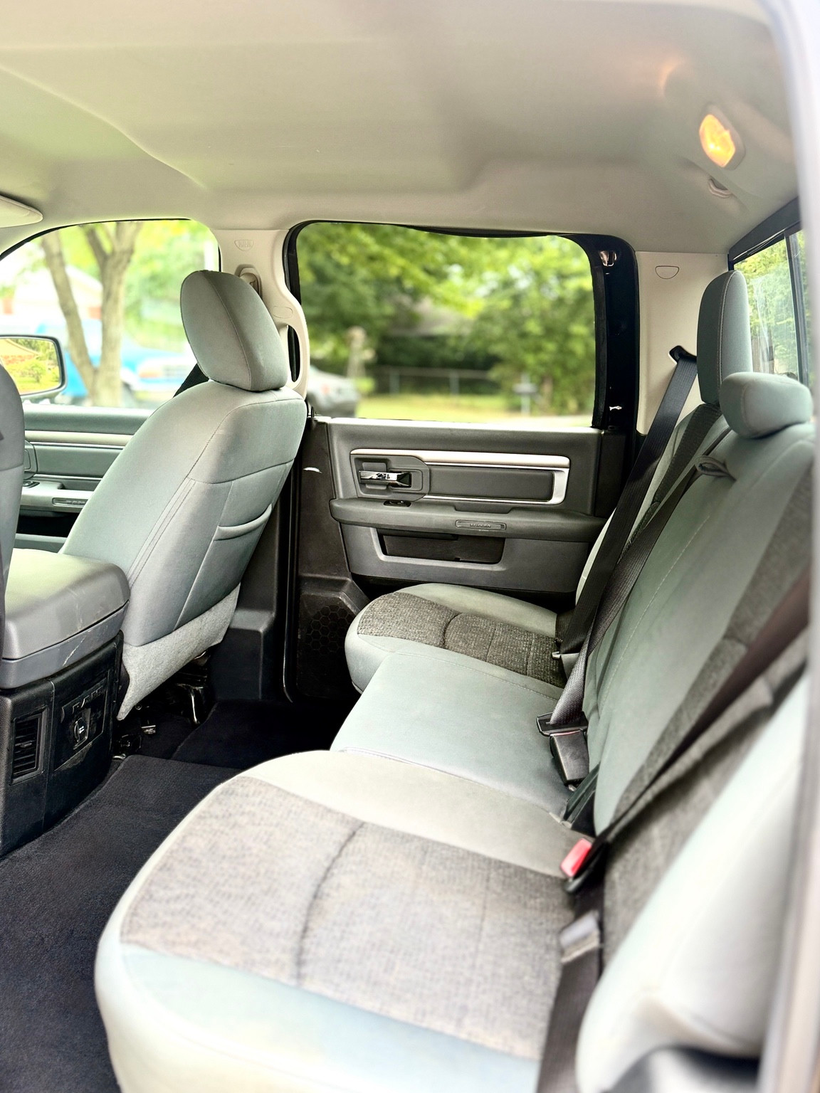 Gray cloth rear bench, carpet and door panels in a pickup cabin