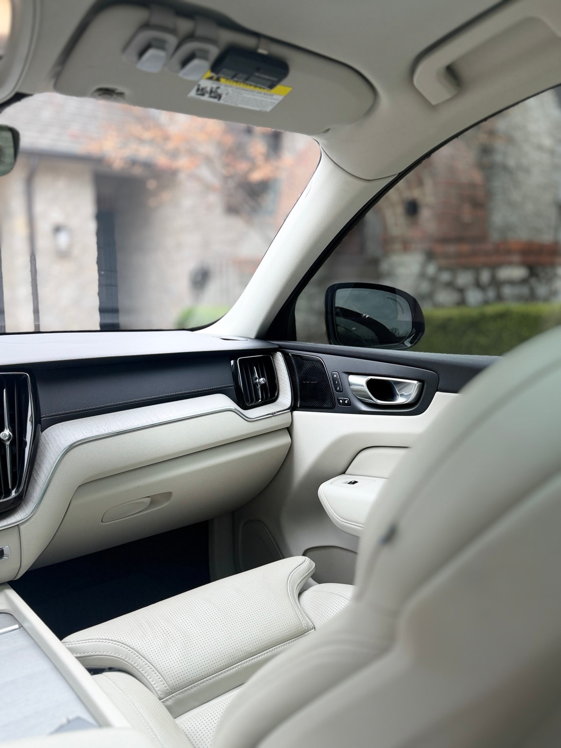 Cream leather passenger seat, dashboard and door trim in a Volvo cabin